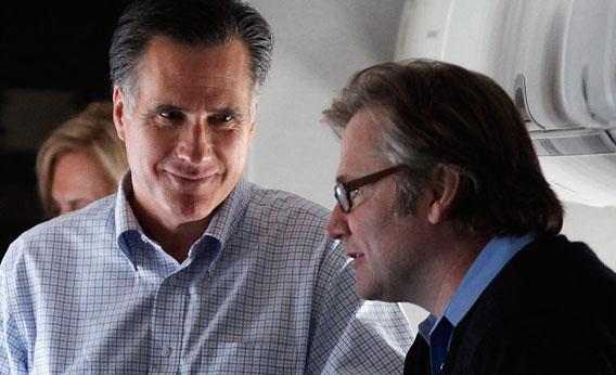Republican presidential candidate and former Massachusetts Governor Mitt Romney (L) talks with campaign advisor Eric Fehrnstrom (R)